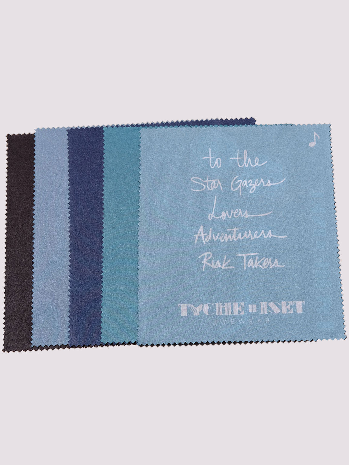 back of cleaning cloth with slogan, "to the star gazers, lovers, adventurers, risk takers, eyewear cleaning cloth, 5 designs, travel accessories, eyewear accessories, microfiber cloth, artwork designs, graphic design, flowers, goddesses, sailboat, sun, moon, wheel, paradise jaguar, aztec mythology, colorful art, original art