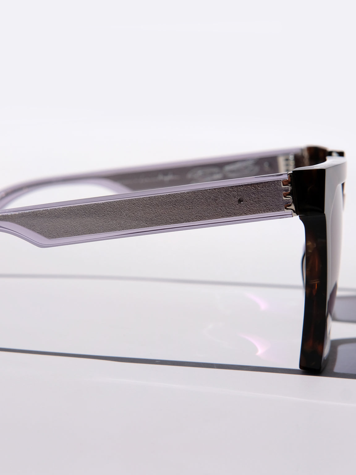 silver metal temple design, sandblasted silver wire core, oversized square sunglasses, 70s vibes, viper, brown striped sunglasses, double down, luxury sunglasses, oversized square glasses, designer eyewear, blue glasses, black glasses, brown glasses, gemstone inspired eyewear, mythology, art deco, goddesses, woman owned business