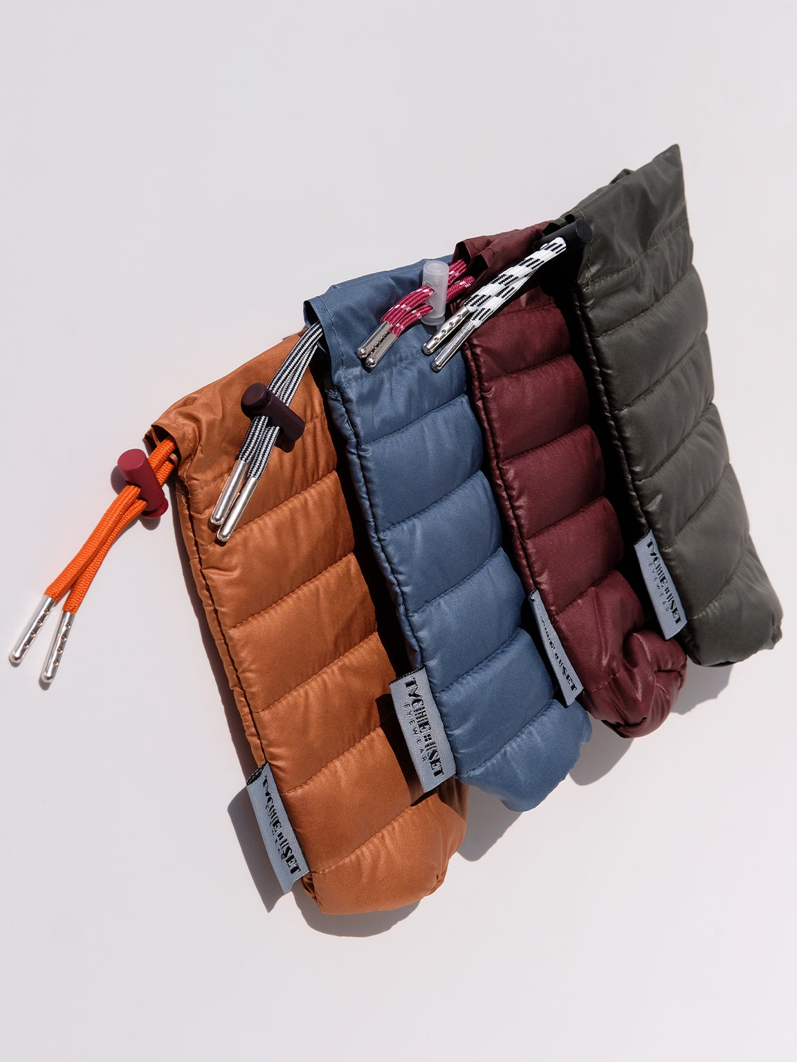 soft eyewear case, optical accessories, sunglass pouch sleeve, available in four colors, made from recycled materials, drawstring pouch for accessories, keys, makeup, phone, wallet, camera and more, travel essentials, luxury optical extras, unisex, organize items, protect from scratches and dust, outdoor activities