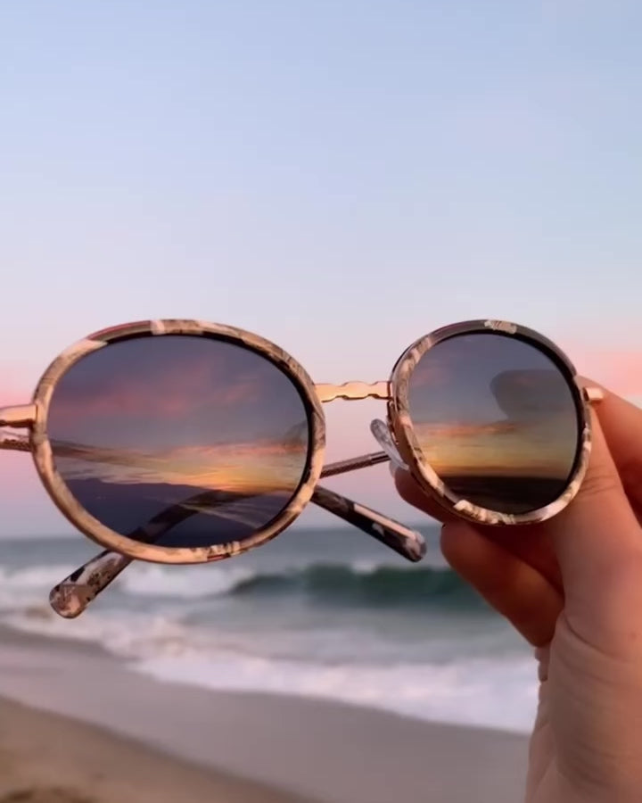 GOLD CLASSIC UNISEX OVAL SUNGLASSES, GOLD METAL DETAILS. DARK NAVY BLUE LENS. ART DECO DESIGN, LIMITED EDITION. DESIGNER EYEWEAR, LUXURY SUNGLASSES. CELEBRITY SUNGLASSES. FEMALE ENTREPRENEUR.
