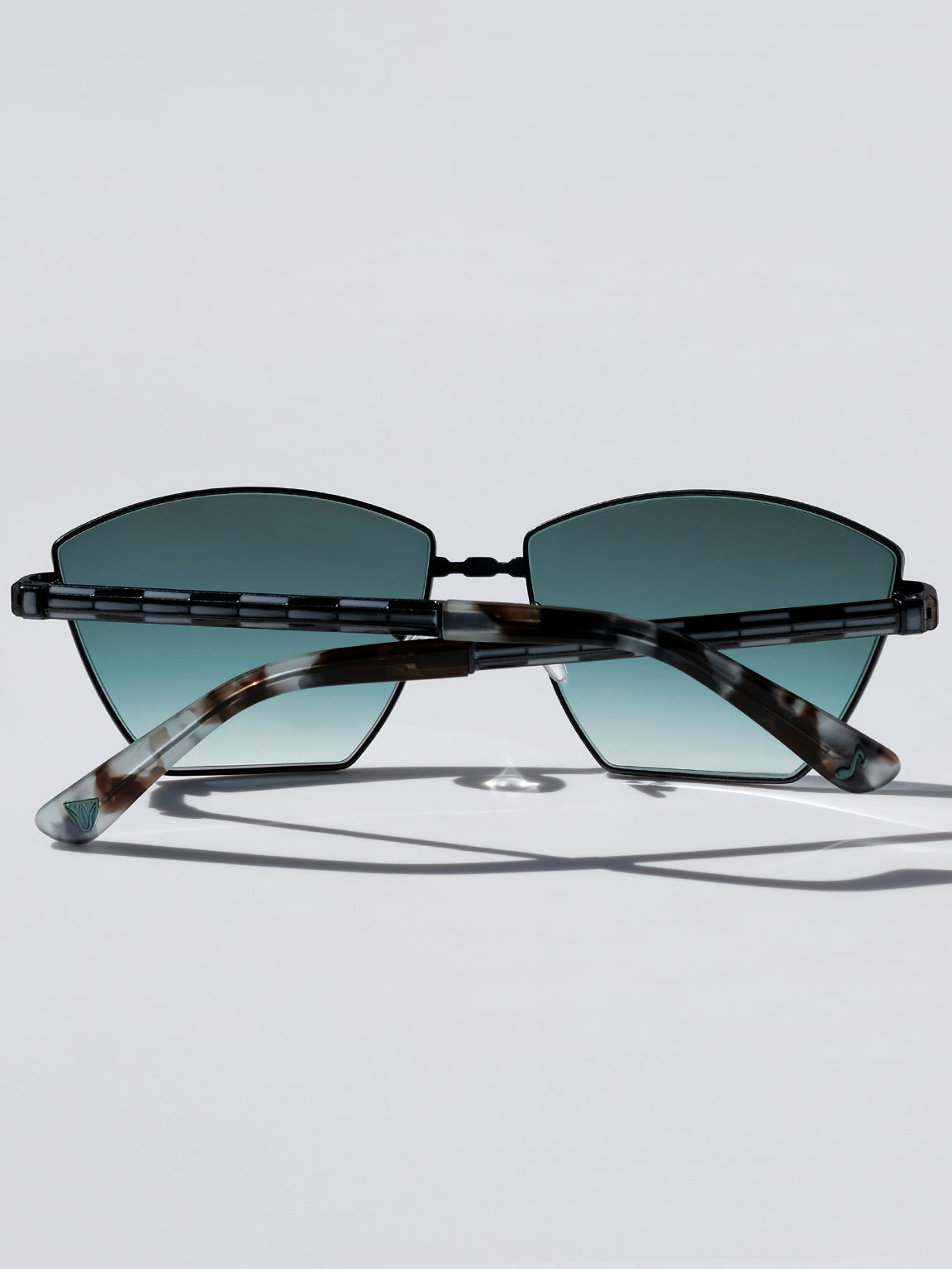 Lightweight titanium glasses, strong titanium sunglasses, sunglasses & optical, luxury eyewear, mazzucchelli italian acetate, made in japan, mythology, eyewear designer, woman owned small business, summer accessories, chic style, celebrity style, aviator glasses, d-frame eyewear, cat eye sunglasses, art deco, geometric art, black glasses, enamel detail