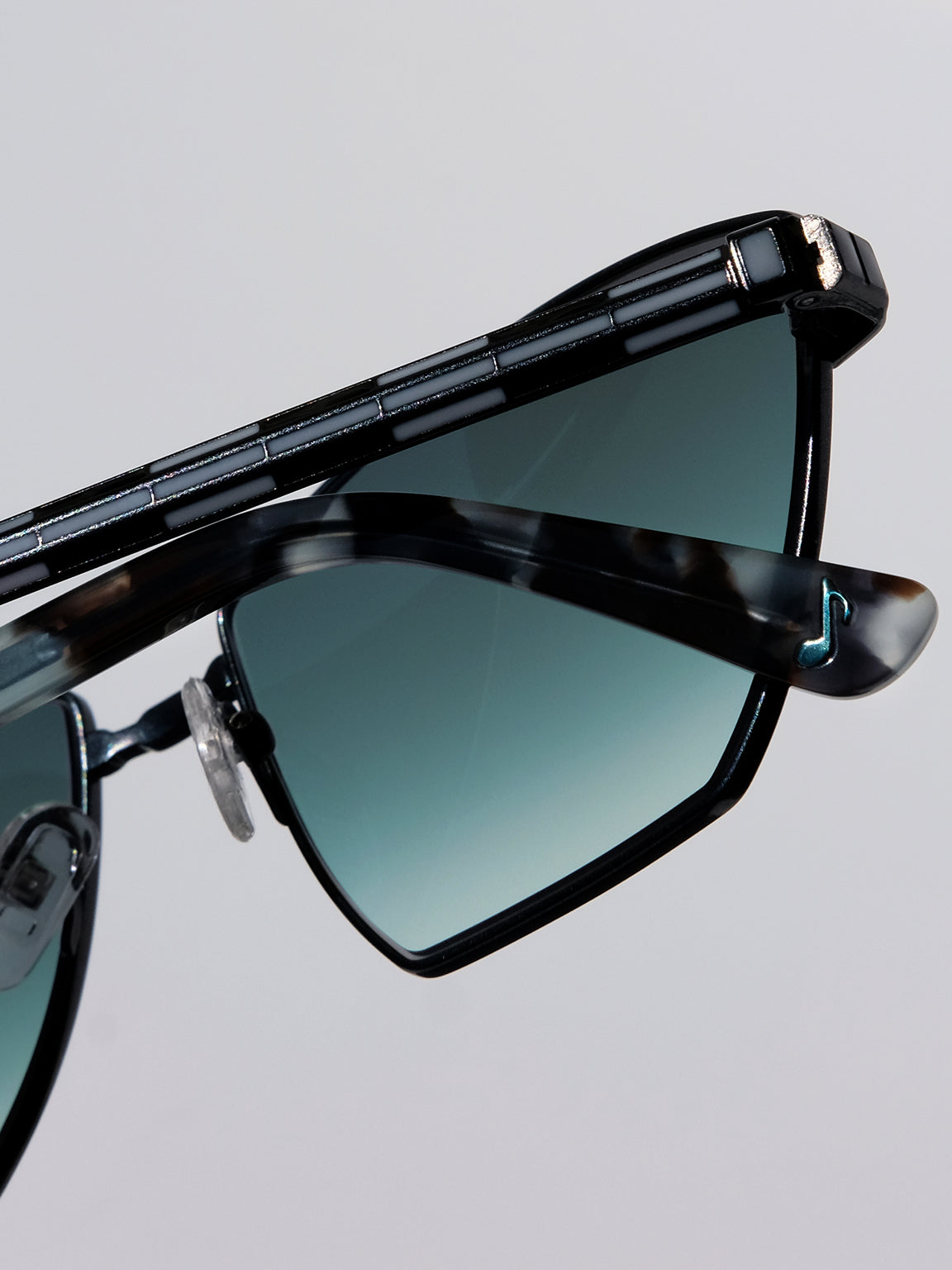 Lightweight titanium glasses, strong titanium sunglasses, sunglasses & optical, luxury eyewear, mazzucchelli italian acetate, made in japan, mythology, eyewear designer, woman owned small business, summer accessories, chic style, celebrity style, aviator glasses, d-frame eyewear, cat eye sunglasses, art deco, geometric art, black glasses, enamel detail