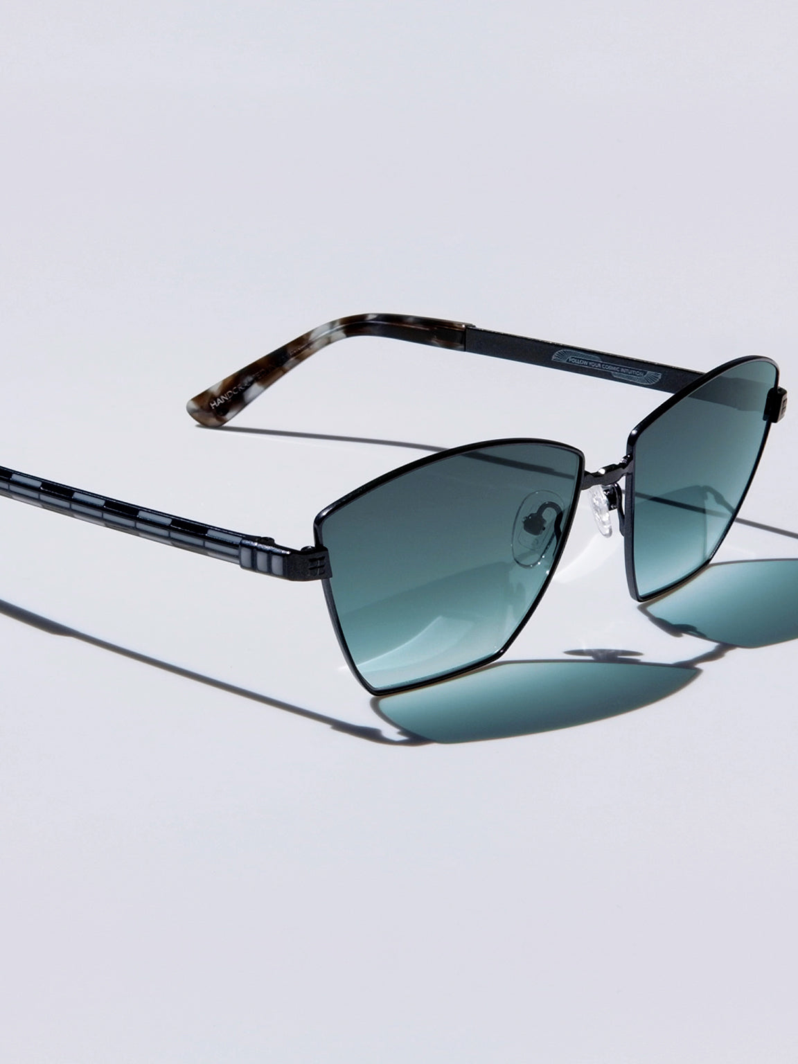 Lightweight titanium glasses, strong titanium sunglasses, sunglasses & optical, luxury eyewear, mazzucchelli italian acetate, made in japan, mythology, eyewear designer, woman owned small business, summer accessories, chic style, celebrity style, aviator glasses, d-frame eyewear, cat eye sunglasses, art deco, geometric art, black glasses, enamel detail