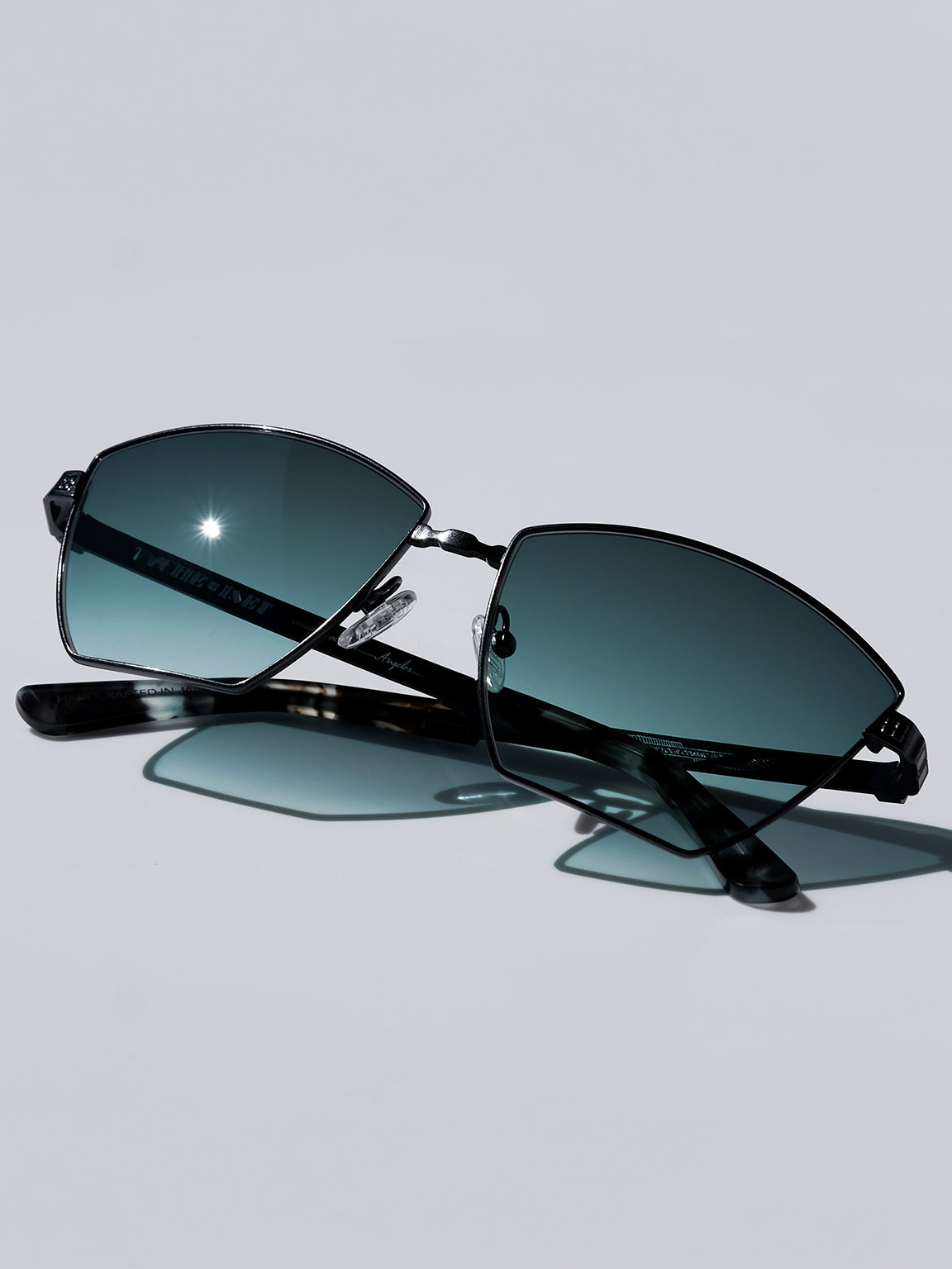 LABYRINTHE IN CARBON: BLACK TITANIUM METAL FRAME SUNGLASSES WITH TEAL