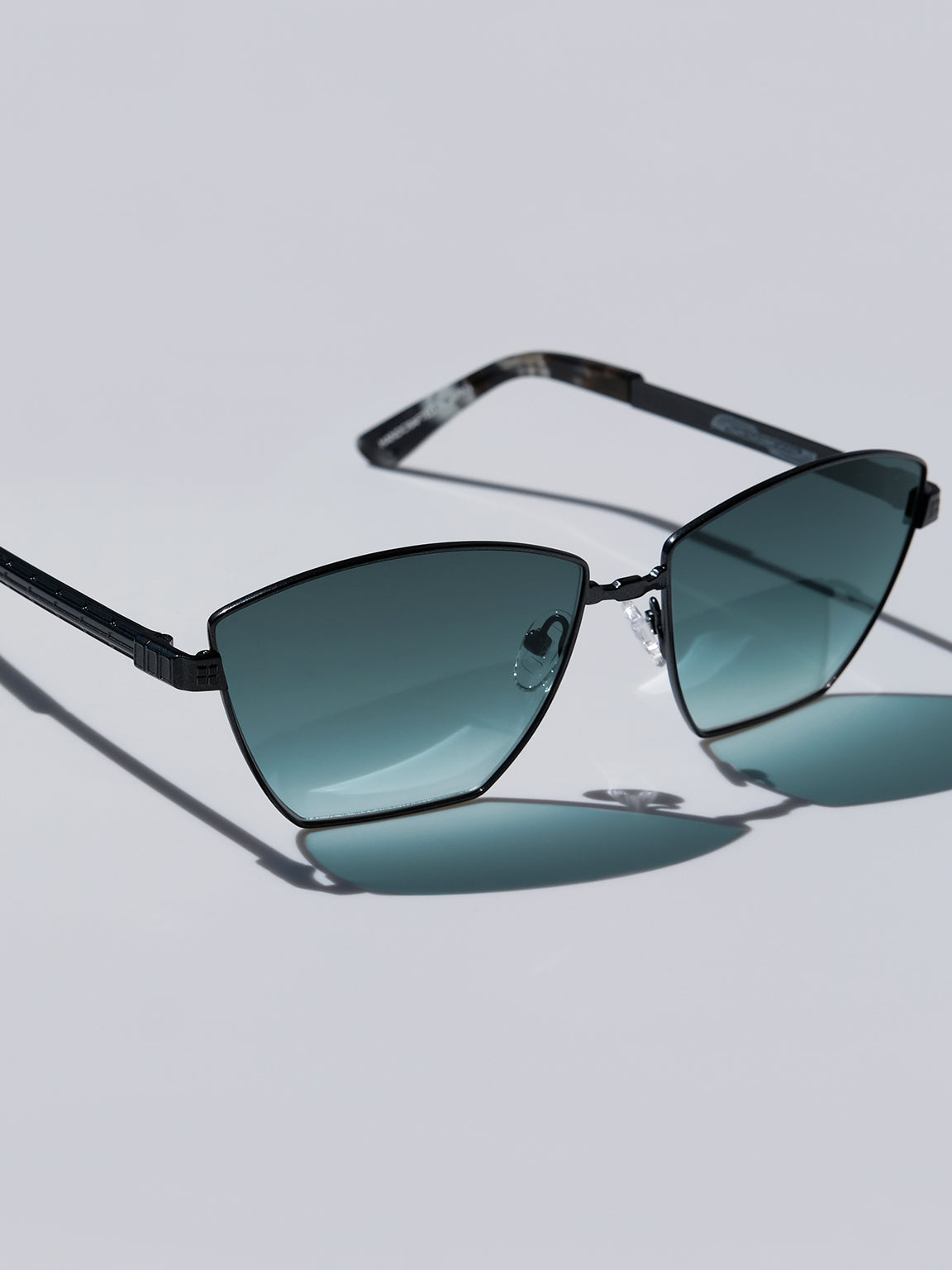 Lightweight titanium glasses, strong titanium sunglasses, sunglasses & optical, luxury eyewear, mazzucchelli italian acetate, made in japan, mythology, eyewear designer, woman owned small business, summer accessories, chic style, celebrity style, aviator glasses, d-frame eyewear, cat eye sunglasses, art deco, geometric art, black glasses