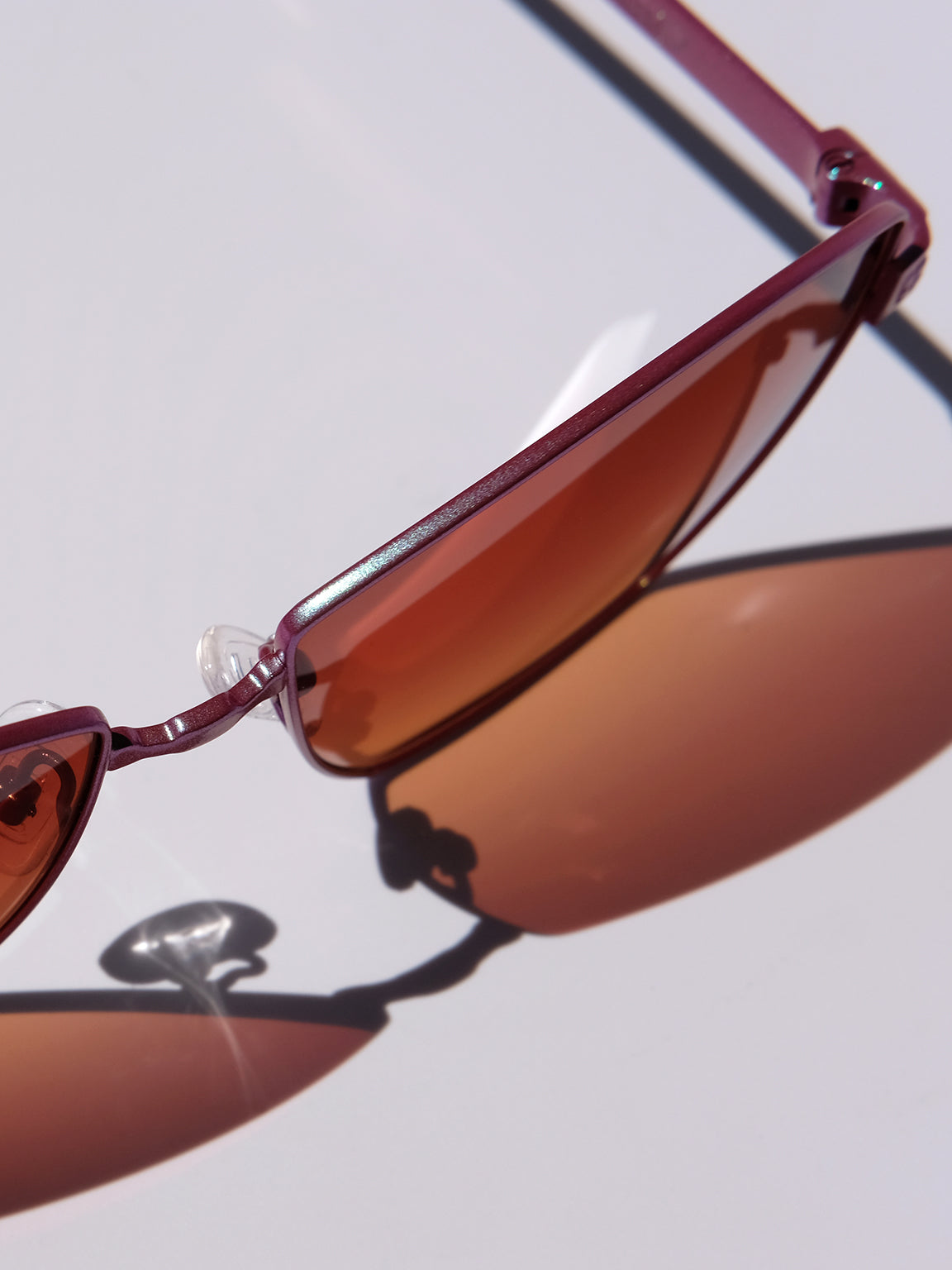 Lightweight titanium glasses, strong titanium sunglasses, sunglasses & optical, luxury eyewear, mazzucchelli italian acetate, made in japan, mythology, eyewear designer, woman owned small business, summer accessories, chic style, celebrity style, aviator glasses, d-frame eyewear, cat eye sunglasses, art deco, geometric art, red glasses, maroon sunglasses