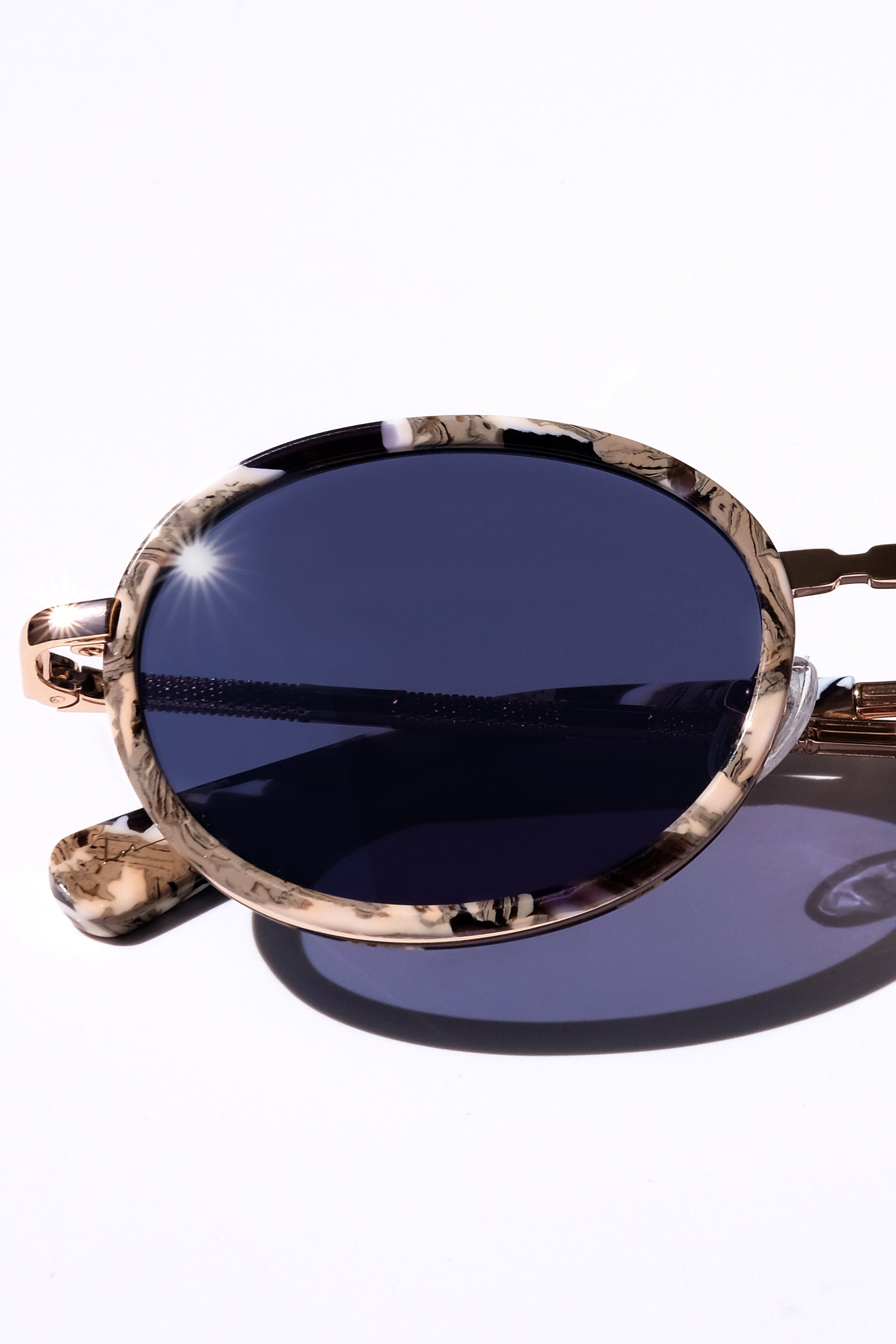 GOLD CLASSIC UNISEX OVAL SUNGLASSES, GOLD METAL DETAILS. DARK NAVY BLUE LENS. ART DECO DESIGN, LIMITED EDITION. DESIGNER EYEWEAR, LUXURY SUNGLASSES. CELEBRITY SUNGLASSES. FEMALE ENTREPRENEUR.