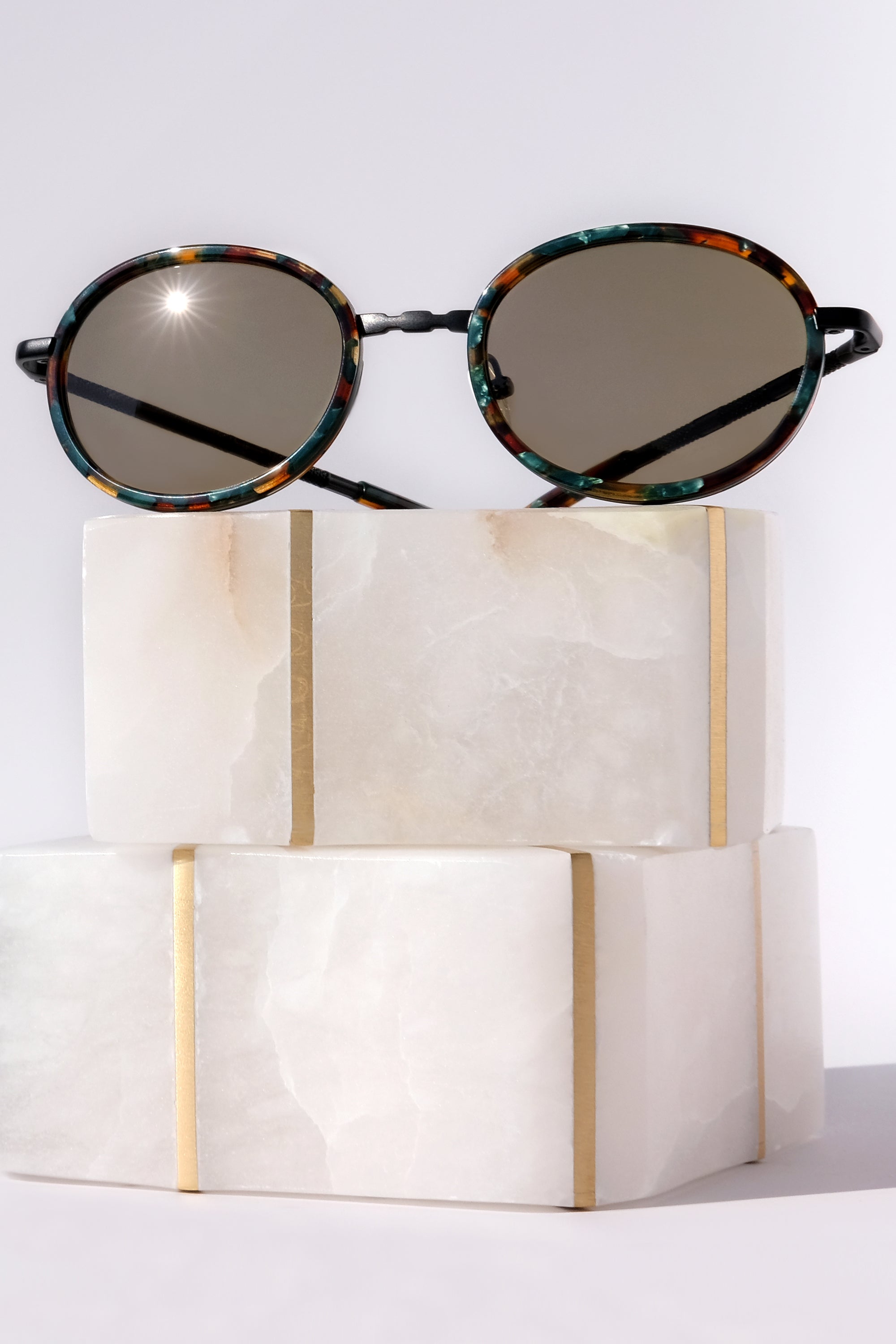 MATTE BLACK CLASSIC UNISEX OVAL SUNGLASSES, MATTE BLACK METAL DETAILS. OLIVE GREEN LENS. ART DECO DESIGN, LIMITED EDITION. DESIGNER EYEWEAR, LUXURY SUNGLASSES. CELEBRITY SUNGLASSES. FEMALE ENTREPRENEUR.