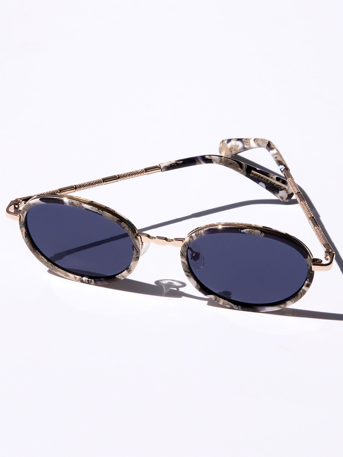 GOLD CLASSIC UNISEX OVAL SUNGLASSES, GOLD METAL DETAILS. DARK NAVY BLUE LENS. ART DECO DESIGN, LIMITED EDITION. DESIGNER EYEWEAR, LUXURY SUNGLASSES. CELEBRITY SUNGLASSES. FEMALE ENTREPRENEUR.