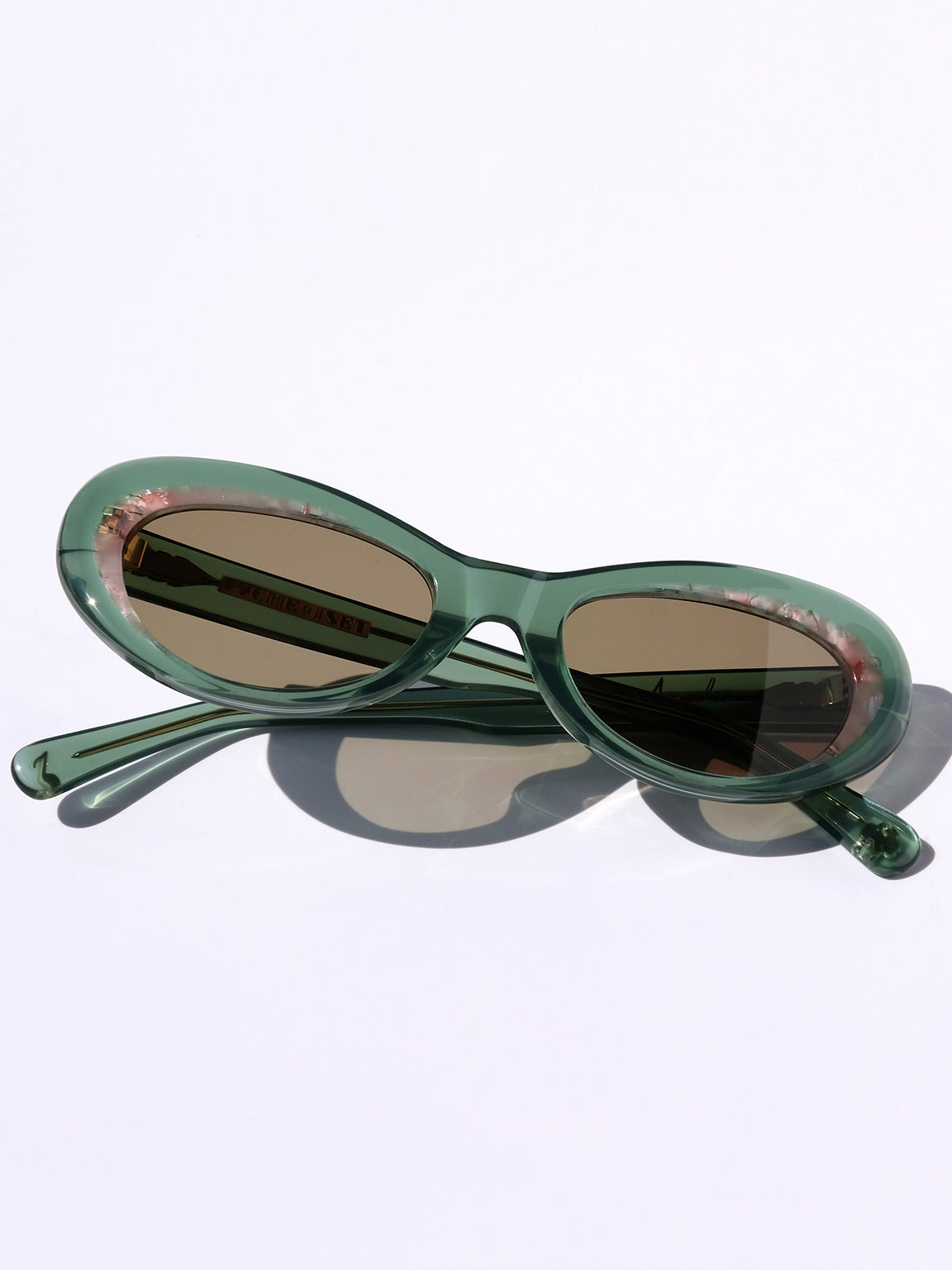 LIGHT GREEN AND PINK CLASSIC CAT EYE SUNGLASSES, GOLD METAL DETAILS. BROWN LENS. ART DECO DESIGN, LIMITED EDITION. DESIGNER EYEWEAR, LUXURY SUNGLASSES. CELEBRITY SUNGLASSES. FEMALE ENTREPRENEUR.