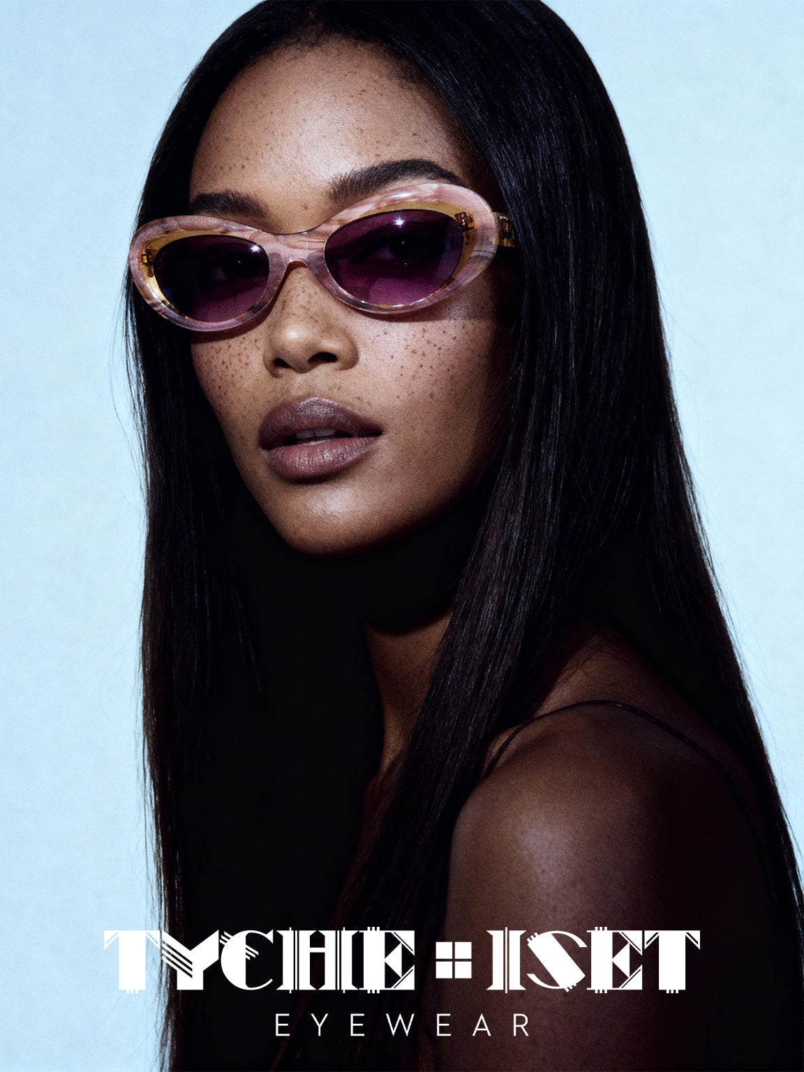 woman wears retro pink cat eye sunglasses with maroon tinted lenses