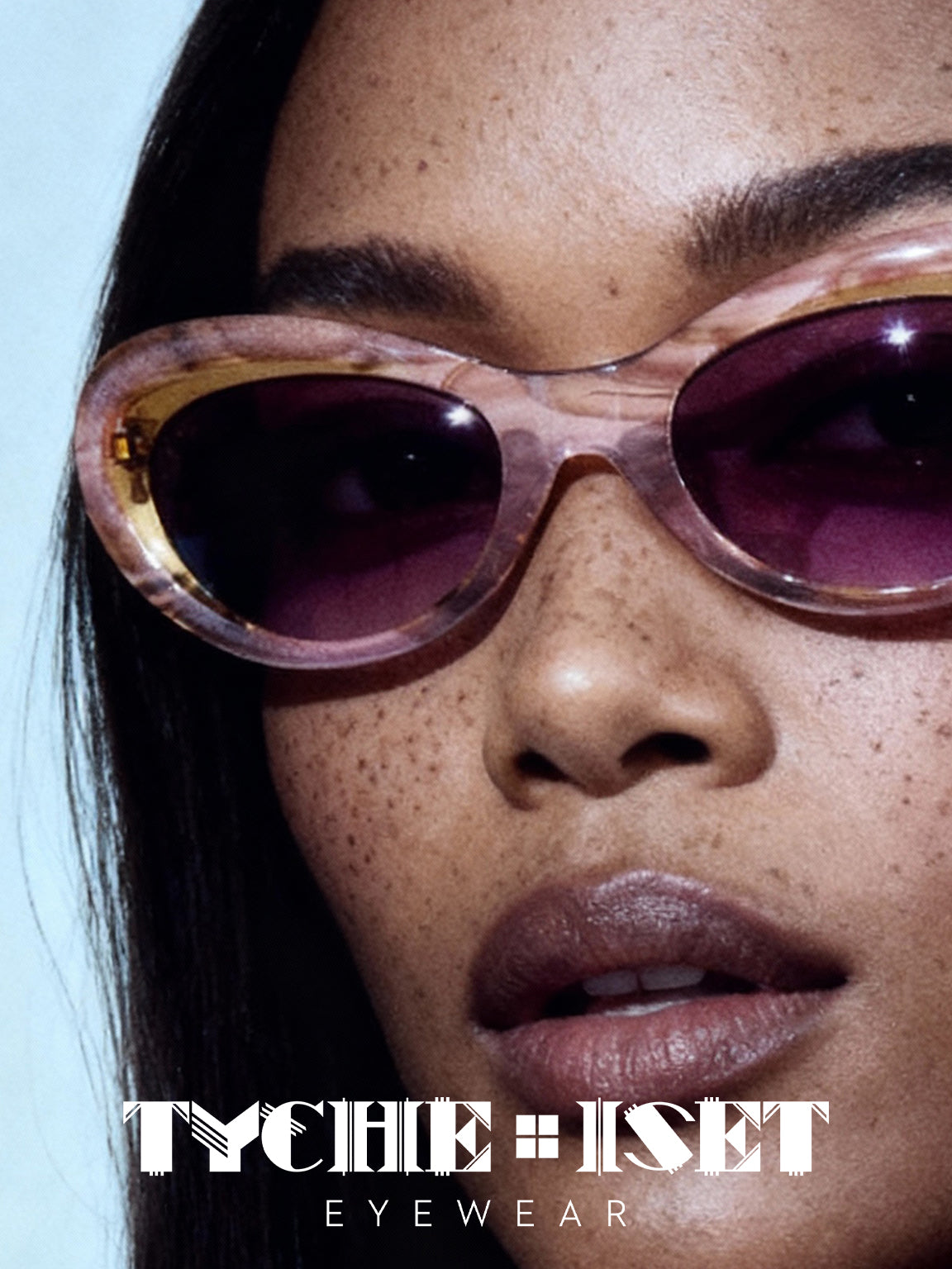 woman wears retro pink cat eye sunglasses with maroon tinted lenses