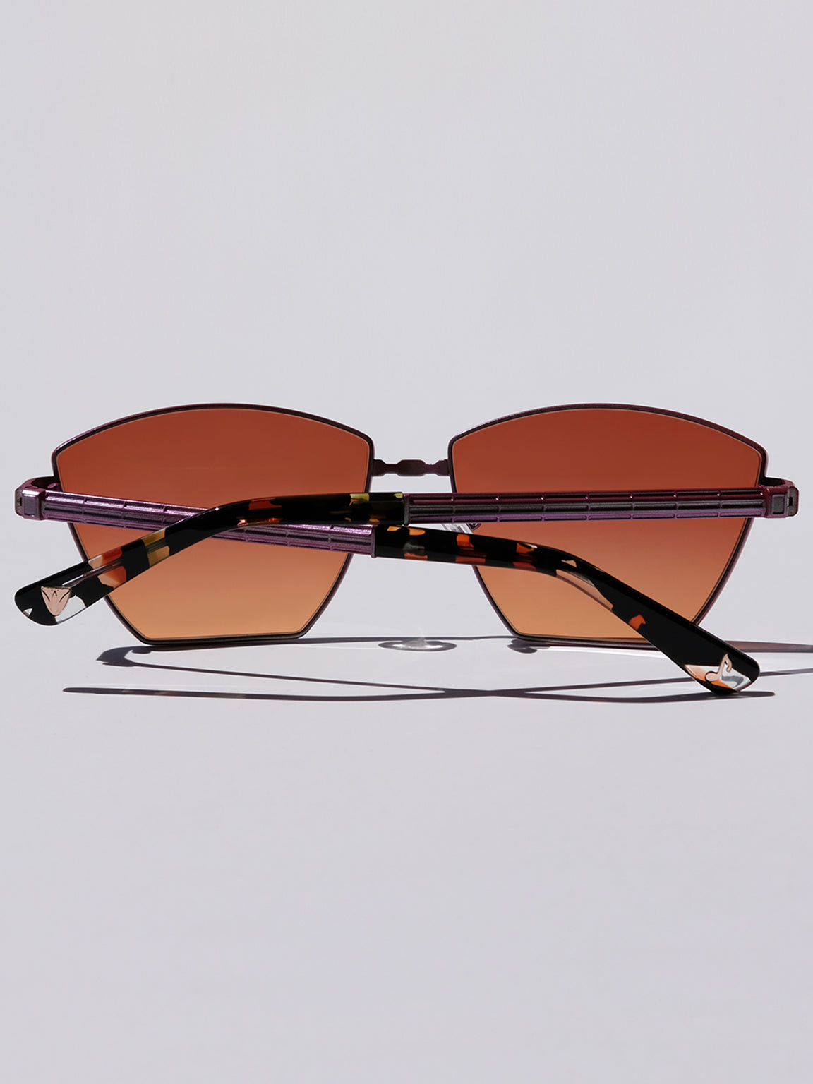Lightweight titanium glasses, strong titanium sunglasses, sunglasses & optical, luxury eyewear, mazzucchelli italian acetate, made in japan, mythology, eyewear designer, woman owned small business, summer accessories, chic style, celebrity style, aviator glasses, d-frame eyewear, cat eye sunglasses, art deco, geometric art, red glasses, maroon sunglasses