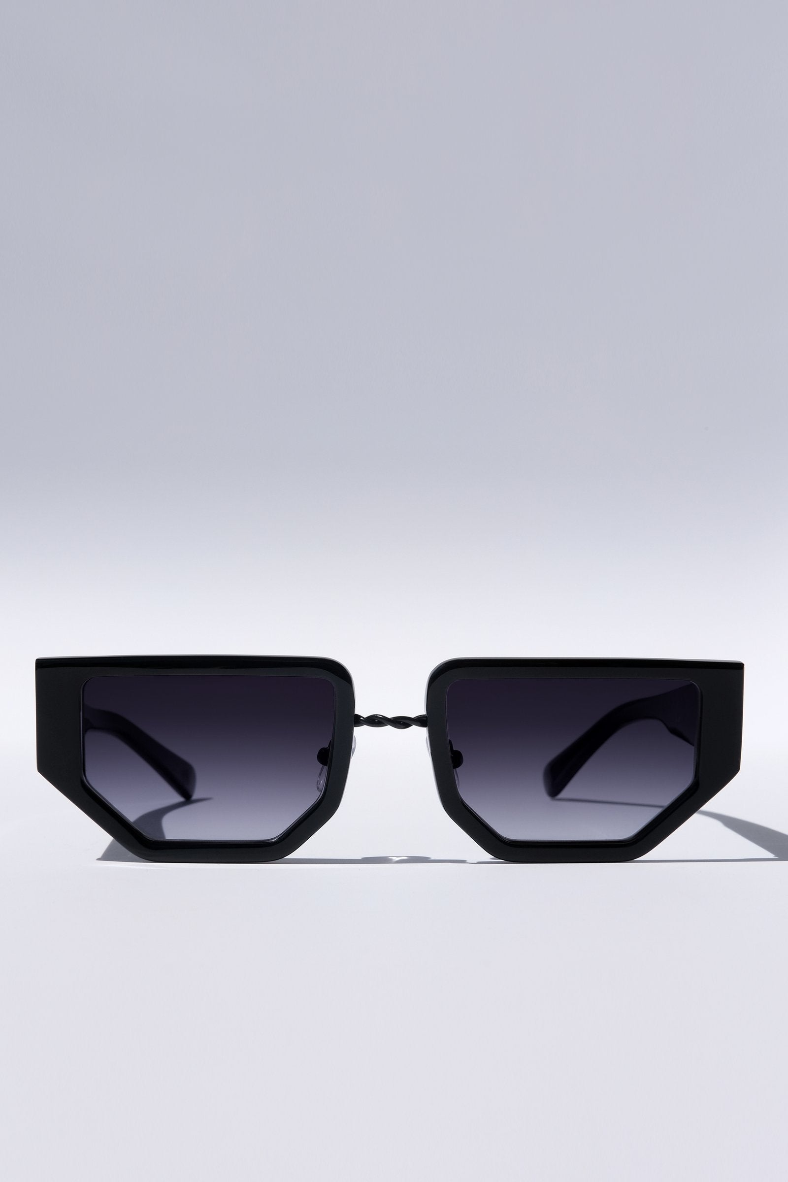 SUNGLASSES, MATTE BLACK METAL DETAILS. DARK BLUE LENS. ART DECO DESIGN, LIMITED EDITION. DESIGNER EYEWEAR, LUXURY SUNGLASSES. CELEBRITY SUNGLASSES. FEMALE ENTREPRENEUR.