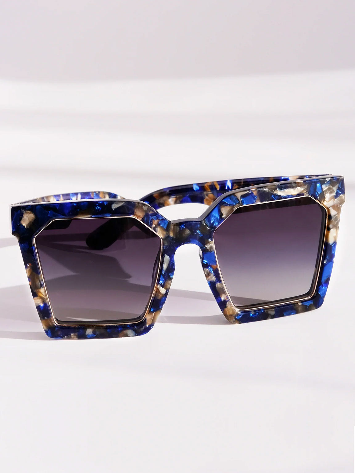 BLUE MARBLE OVERSIZED SQUARE UNISEX SUNGLASSES, GOLD METAL DETAILS. BLUE GREY GRADIENT LENS. ART DECO DESIGN, LIMITED EDITION. DESIGNER EYEWEAR, LUXURY SUNGLASSES. CELEBRITY SUNGLASSES. FEMALE ENTREPRENEUR.